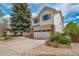 Two-story house featuring an attached two-car garage, landscaped yard, and neutral exterior with nice backyard at 7072 Palisade Dr, Highlands Ranch, CO 80130