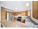 Functional kitchen with wood cabinetry, granite countertops, stainless steel fridge, and modern fixtures with good light at 7072 Palisade Dr, Highlands Ranch, CO 80130