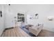 Bright living room with large windows, modern decor, and an open floor plan at 7072 Palisade Dr, Highlands Ranch, CO 80130
