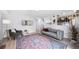 Cozy living room with a fireplace and staircase access at 7072 Palisade Dr, Highlands Ranch, CO 80130