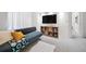 Cozy living room features comfortable seating, modern decor, and seamless access to a hallway and other rooms at 7072 Palisade Dr, Highlands Ranch, CO 80130