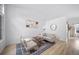 Cozy living area with stylish furniture, light walls, wood floors, and minimalist decor for a modern look at 7072 Palisade Dr, Highlands Ranch, CO 80130