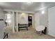 Open basement area with carpet, featuring stylish seating and views into adjacent room at 841 Crisman Dr # 9, Longmont, CO 80501