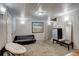 Finished basement features a comfortable seating area with bright lighting and mini-fridge at 841 Crisman Dr # 9, Longmont, CO 80501