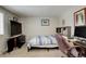 Comfortable bedroom with neutral walls, carpet and workspace setup at 841 Crisman Dr # 9, Longmont, CO 80501