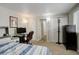 Cozy bedroom with carpet, featuring a workspace and ample closet space at 841 Crisman Dr # 9, Longmont, CO 80501