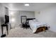 Functional bedroom design featuring a work space, television, and cozy carpet at 841 Crisman Dr # 9, Longmont, CO 80501