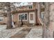 Charming townhouse front entrance featuring a quaint porch, and a neatly landscaped yard in a cozy neighborhood at 841 Crisman Dr # 9, Longmont, CO 80501