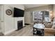 Comfortable living room featuring a fireplace with a large television mounted above it at 841 Crisman Dr # 9, Longmont, CO 80501