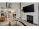 Bright living area features a modern fireplace, neutral décor, and wood floors, seamlessly connecting to the kitchen at 841 Crisman Dr # 9, Longmont, CO 80501
