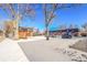 Exterior view of a building complex with parking area and snow cover at 5930 W 41St Ave, Wheat Ridge, CO 80212