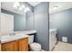 Powder bathroom with a vanity and sink, plus a washer and dryer at 14625 Vine St, Thornton, CO 80602