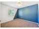 Bedroom featuring carpeted floor, window and blue accent wall at 14625 Vine St, Thornton, CO 80602