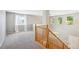 Open foyer features carpeted sitting area, staircase and abundant natural light at 14625 Vine St, Thornton, CO 80602