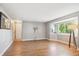 Spacious living room with a large window and hardwood floors throughout at 14625 Vine St, Thornton, CO 80602