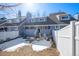 Townhouse exterior with a cozy backyard featuring a grill and seating area at 10634 Park Mtn, Littleton, CO 80127