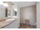 A bright bathroom features a vanity, storage cabinet, and a decorative wall-mounted coat rack at 10634 Park Mtn, Littleton, CO 80127