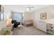 Bedroom featuring a baby crib, chair, changing table, and a bright overhead ceiling fan at 10634 Park Mtn, Littleton, CO 80127