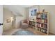 A nook with large bookcase and reading chair receives natural light from a picture window at 10634 Park Mtn, Littleton, CO 80127
