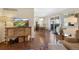 Dining area adjacent to living room with hardwood floors, natural light and adjacent access to the kitchen at 10634 Park Mtn, Littleton, CO 80127