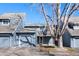 Charming townhome featuring a two-car garage, inviting front porch and beautifully maintained landscaping at 10634 Park Mtn, Littleton, CO 80127
