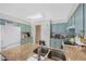 Large kitchen with a breakfast bar, granite countertops, and blue-painted cabinets at 10634 Park Mtn, Littleton, CO 80127
