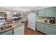 Open-concept kitchen with a dining nook, stainless-steel dishwasher, and granite countertops at 10634 Park Mtn, Littleton, CO 80127