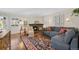 Cozy living room featuring a warm fireplace, plush seating, and stylish decor accents at 10634 Park Mtn, Littleton, CO 80127