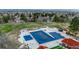 Aerial view of the community pool and green space offering a cool retreat in warmer months at 10634 Park Mtn, Littleton, CO 80127