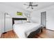 Bright bedroom with ceiling fan, closet, and a painting of horses at 3380 S Ogden St, Englewood, CO 80113