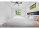Bedroom with a ceiling fan, hardwood floors, and a painting of horses at 3380 S Ogden St, Englewood, CO 80113