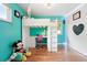 Unique bedroom with lofted bed, desk area, and colorful decor at 3380 S Ogden St, Englewood, CO 80113