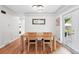 Cozy dining area featuring a wooden table, two chairs, and an adjacent doorway at 3380 S Ogden St, Englewood, CO 80113