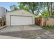 One car detached garage and driveway and a wooden privacy fence at 3380 S Ogden St, Englewood, CO 80113