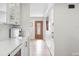 Hallway leading to the front door and the kitchen at 3380 S Ogden St, Englewood, CO 80113