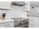Close up of kitchen with stainless steel oven and countertops at 3380 S Ogden St, Englewood, CO 80113