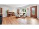Bright living room featuring hardwood floors, a large window, comfortable seating, and a stylish decor at 3380 S Ogden St, Englewood, CO 80113