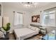 Cozy bedroom with hardwood floors, natural light, and minimalist decor at 1309 Jamaica St, Aurora, CO 80010