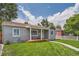 Charming single-story home with a well-maintained lawn and welcoming front porch at 1309 Jamaica St, Aurora, CO 80010