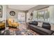 Comfortable living room with stylish furnishings, hardwood floors, and great natural light at 1309 Jamaica St, Aurora, CO 80010