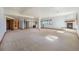 Finished basement featuring a bar area, fireplace, and neutral carpeting at 497 Grey Squirrel Way, Franktown, CO 80116