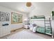 This bedroom features bunk beds, lots of natural light, and modern decor at 497 Grey Squirrel Way, Franktown, CO 80116