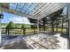 This covered deck features wooden floors, a scenic backyard view, and plenty of room to relax at 497 Grey Squirrel Way, Franktown, CO 80116