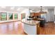 Bright dining area with hardwood floors, skylights, sliding door access to the deck, and scenic outdoor views at 497 Grey Squirrel Way, Franktown, CO 80116