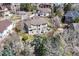 Aerial view of the house with patio and lush backyard on a sunny day at 22386 E Arbor Pl, Aurora, CO 80016
