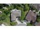 Aerial view of a property with a spacious layout, mature trees, and a well-manicured lawn at 22386 E Arbor Pl, Aurora, CO 80016