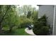 Serene backyard with lush greenery, a cozy seating area, and a well-maintained lawn at 22386 E Arbor Pl, Aurora, CO 80016
