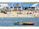 Vibrant beach scene with families enjoying the water and various beachside amenities at 22386 E Arbor Pl, Aurora, CO 80016