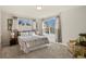 Charming bedroom featuring soft natural light, a comfortable bed, and cozy decor at 22386 E Arbor Pl, Aurora, CO 80016