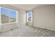 Bright bedroom with plush carpet, large windows, and ample natural light at 22386 E Arbor Pl, Aurora, CO 80016